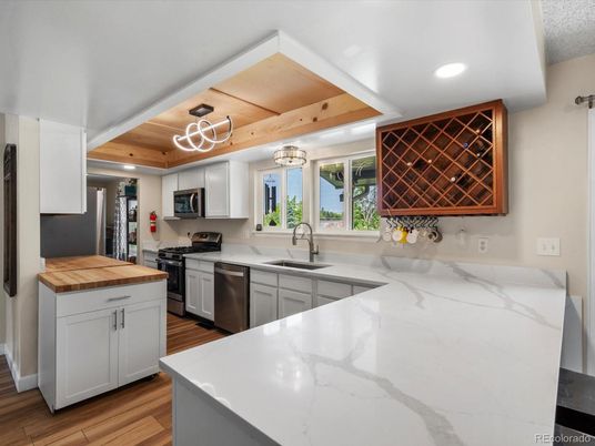 Chandelier, Interior, Kitchen, Pendant Lights, Recessed Lighting, Stainless Steel Appliances, Wooden Beams, Wooden Ceilings, Wood Texture Flooring