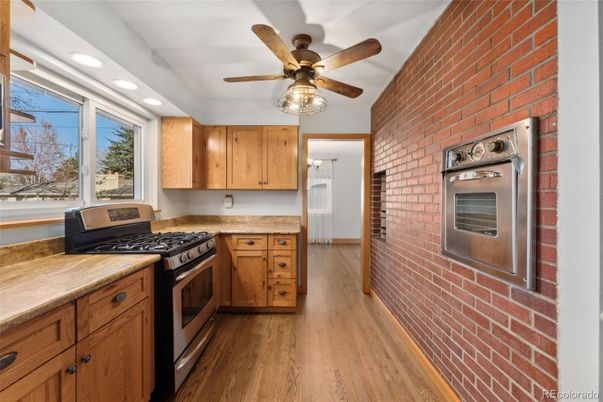 Interior, Kitchen, Recessed Lighting, Stainless Steel Appliances, Stone Walls, Wood Texture Flooring