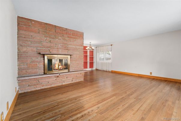 Chandelier, Empty room, Fireplace, Interior, Pendant Lights, Stone Walls, Wood Texture Flooring