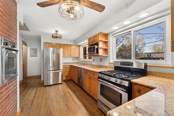 Interior, Kitchen, Recessed Lighting, Stainless Steel Appliances, Stone Walls, Wood Texture Flooring