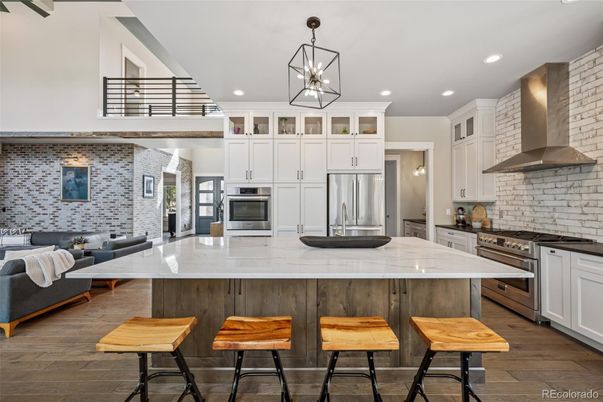 Interior, Kitchen, Living room, Pendant Lights, Recessed Lighting, Stainless Steel Appliances, Stone Walls, Wood Texture Flooring
