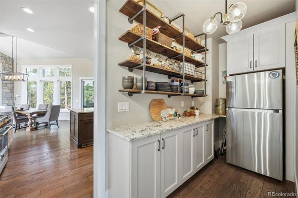 Chandelier, Dining room, Interior, Kitchen, Pendant Lights, Recessed Lighting, Stainless Steel Appliances, Wood Texture Flooring