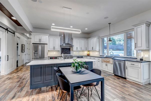 Dining room, Interior, Kitchen, Pendant Lights, Recessed Lighting, Stainless Steel Appliances, Wood Texture Flooring