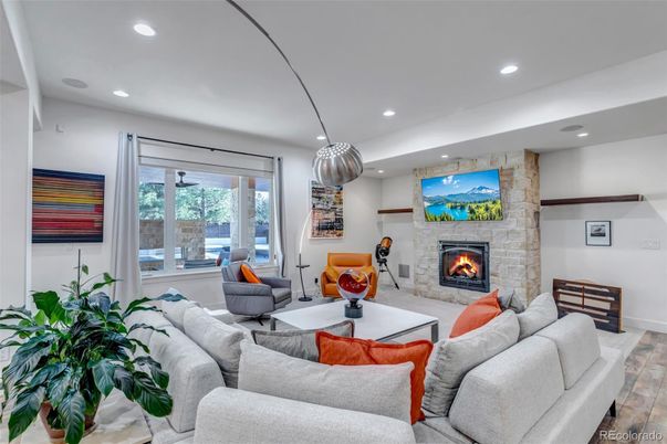 Fireplace, Interior, Living room, Pendant Lights, Recessed Lighting, Stone Walls, Wood Texture Flooring