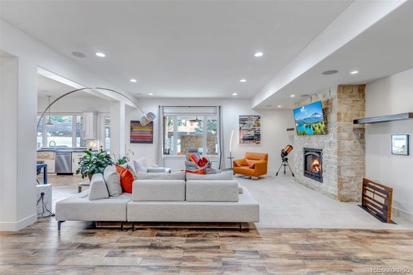 Fireplace, Interior, Living room, Recessed Lighting, Stone Walls, Wood Texture Flooring
