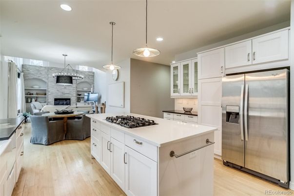Dining room, Fireplace, Interior, Kitchen, Living room, Pendant Lights, Recessed Lighting, Stainless Steel Appliances, Wood Texture Flooring