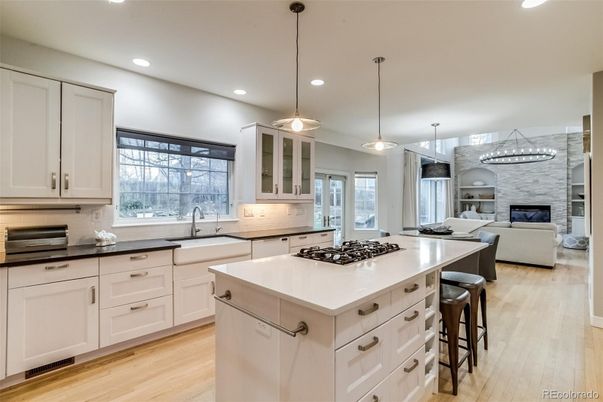 Fireplace, Interior, Kitchen, Living room, Pendant Lights, Recessed Lighting, Stainless Steel Appliances, Wood Texture Flooring