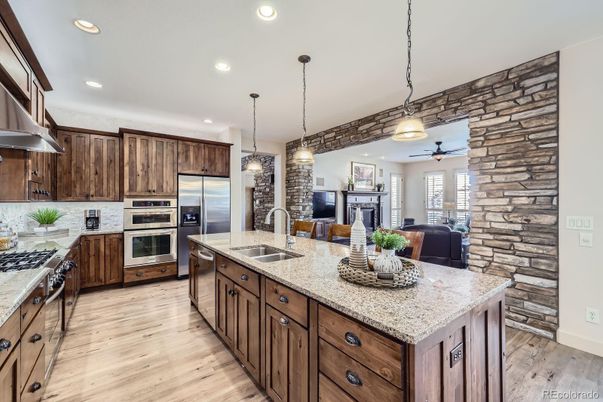 Dining room, Interior, Kitchen, Pendant Lights, Recessed Lighting, Stainless Steel Appliances, Stone Walls, Wood Texture Flooring