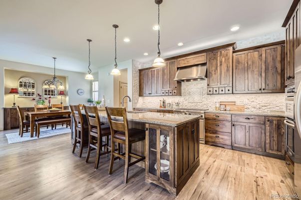 Chandelier, Dining room, Interior, Kitchen, Pendant Lights, Recessed Lighting, Stainless Steel Appliances, Wood Texture Flooring