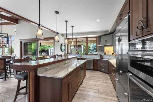 Dining room, Interior, Kitchen, Pendant Lights, Recessed Lighting, Stainless Steel Appliances, Wood Texture Flooring