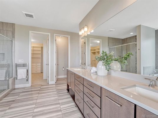 Bathroom, Dual Sink Vanities, Glass Shower, Interior, Recessed Lighting, Walk-in Closets