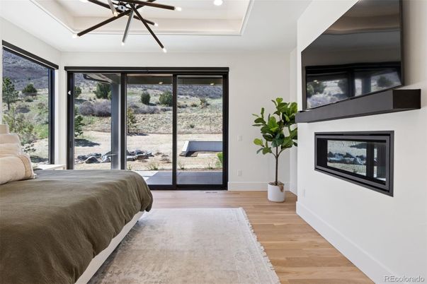 Bedroom, Fireplace, Interior, Pendant Lights, Recessed Lighting, Wood Texture Flooring