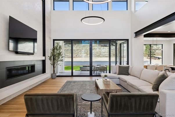 Dining room, Fireplace, Interior, Living room, Pendant Lights, Recessed Lighting, Water, Wood Texture Flooring