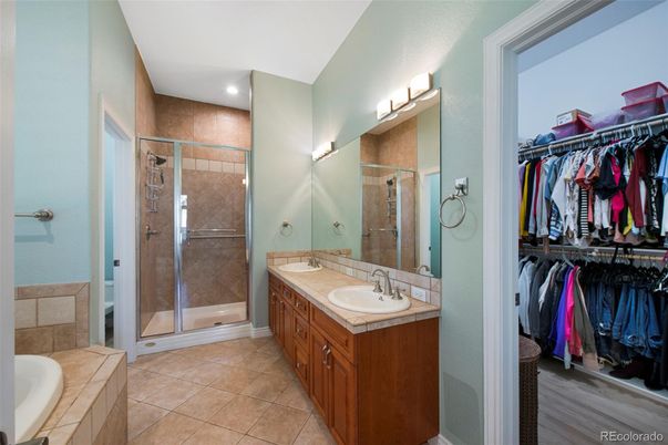 Bathroom, Dual Sink Vanities, Glass Shower, Interior, Recessed Lighting, Tile Countertops, Walk-in Closets