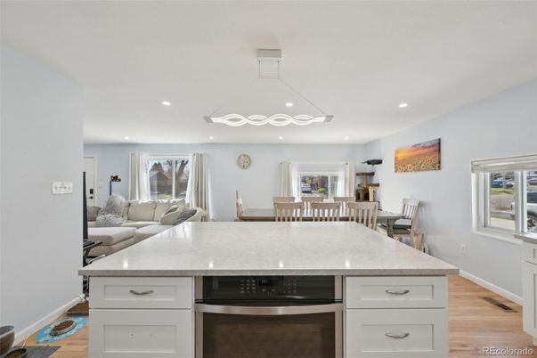 Dining room, Interior, Kitchen, Recessed Lighting, Stainless Steel Appliances, Wood Texture Flooring