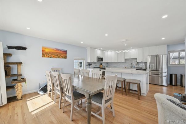 Dining room, Interior, Kitchen, Recessed Lighting, Stainless Steel Appliances, Wood Texture Flooring