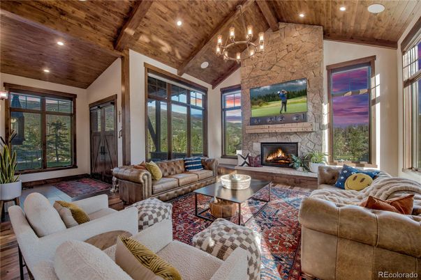 Chandelier, Fireplace, Interior, Living room, Recessed Lighting, Stone Walls, Wooden Beams, Wooden Ceilings