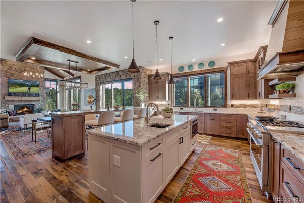 Dining room, Fireplace, Interior, Kitchen, Living room, Pendant Lights, Recessed Lighting, Stainless Steel Appliances, Wooden Beams, Wooden Ceilings, Wood Texture Flooring