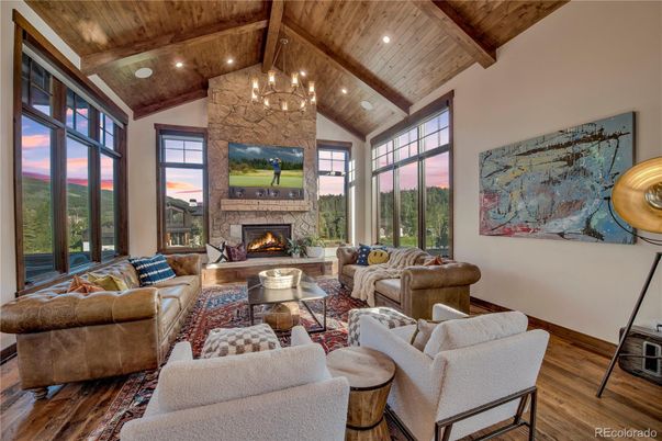 Chandelier, Fireplace, Interior, Living room, Recessed Lighting, Stone Walls, Wooden Beams, Wooden Ceilings, Wood Texture Flooring