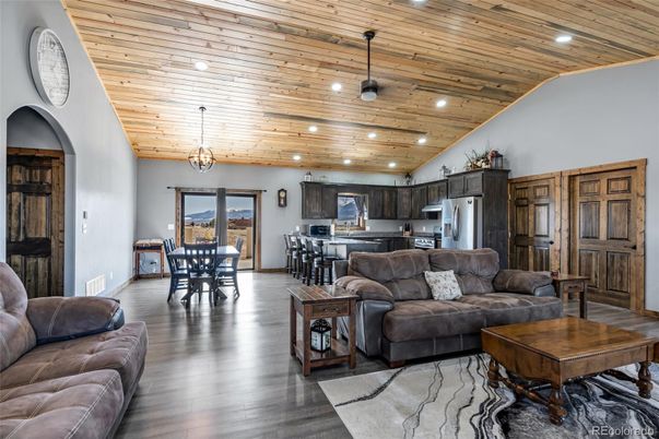 Dining room, Interior, Kitchen, Living room, Pendant Lights, Recessed Lighting, Stainless Steel Appliances, Wooden Ceilings, Wood Texture Flooring