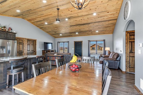 Dining room, Interior, Kitchen, Living room, Pendant Lights, Recessed Lighting, Stainless Steel Appliances, Wooden Ceilings, Wood Texture Flooring