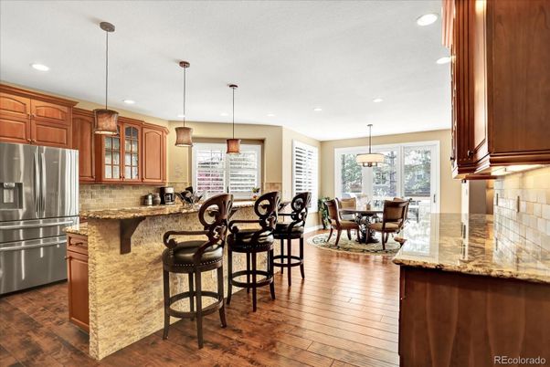 Dining room, Interior, Kitchen, Pendant Lights, Recessed Lighting, Stainless Steel Appliances, Wood Texture Flooring
