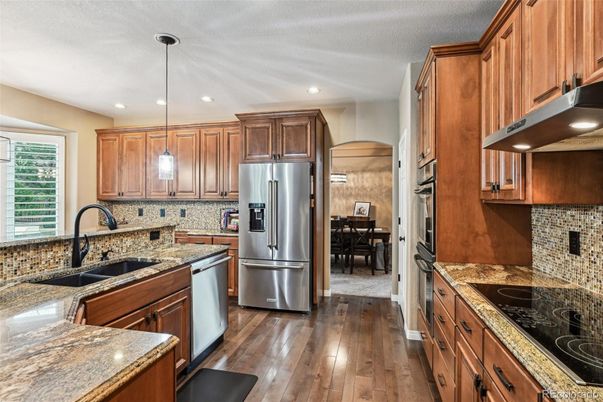 Dining room, Interior, Kitchen, Pendant Lights, Recessed Lighting, Stainless Steel Appliances, Wood Texture Flooring