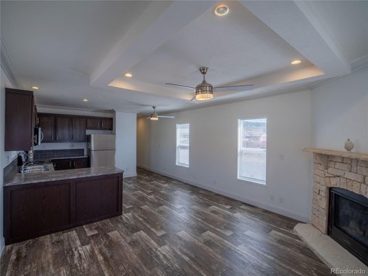 Empty room, Fireplace, Interior, Kitchen, Recessed Lighting, Wood Texture Flooring