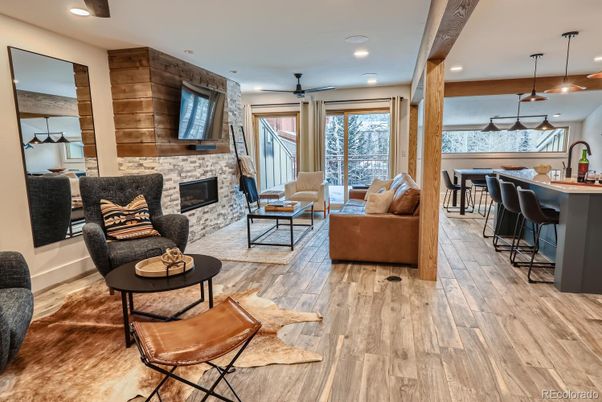 Fireplace, Interior, Living room, Pendant Lights, Recessed Lighting, Stone Walls, Wood Texture Flooring, Wooden Walls