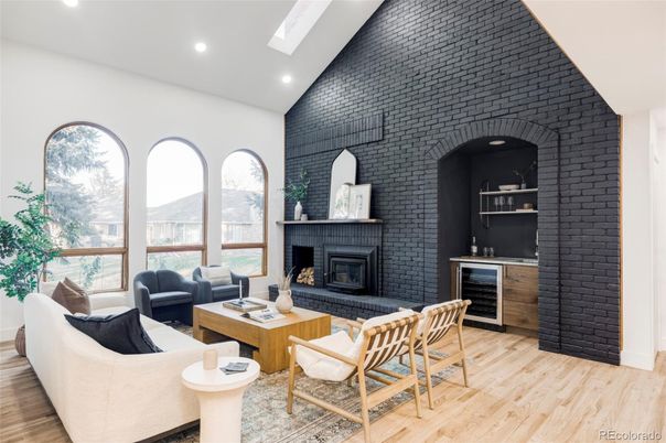 Fireplace, Interior, Living room, Recessed Lighting, Stone Walls, Wood Texture Flooring