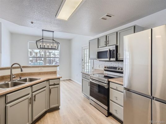 Interior, Kitchen, Pendant Lights, Stainless Steel Appliances, Wood Texture Flooring