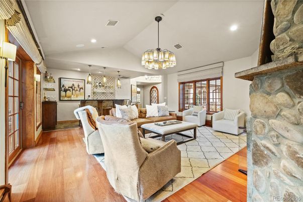 Fireplace, Interior, Living room, Pendant Lights, Recessed Lighting, Stone Walls, Wood Texture Flooring