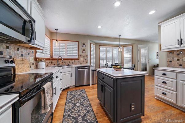 Dining room, Interior, Kitchen, Pendant Lights, Recessed Lighting, Stainless Steel Appliances, Wood Texture Flooring