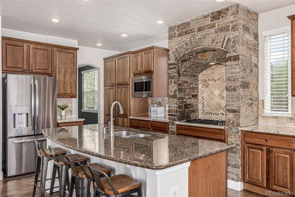 Interior, Kitchen, Recessed Lighting, Stainless Steel Appliances, Stone Walls, Wood Texture Flooring