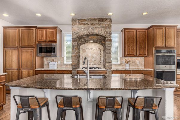 Interior, Kitchen, Recessed Lighting, Stainless Steel Appliances, Stone Walls, Wood Texture Flooring