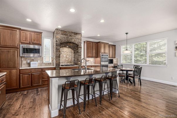 Dining room, Interior, Kitchen, Pendant Lights, Recessed Lighting, Stainless Steel Appliances, Stone Walls, Wood Texture Flooring