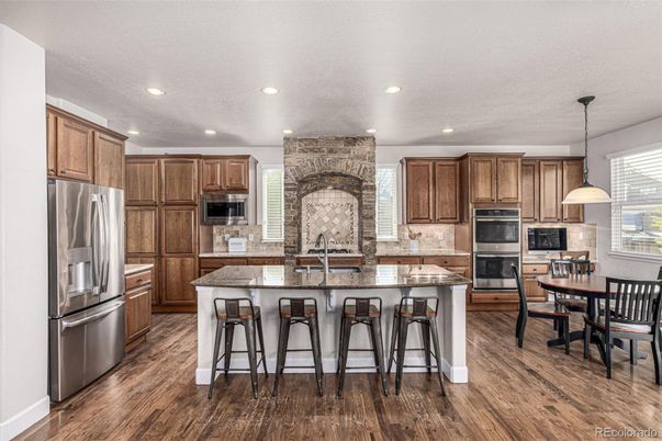 Dining room, Interior, Kitchen, Pendant Lights, Recessed Lighting, Stainless Steel Appliances, Stone Walls, Wood Texture Flooring
