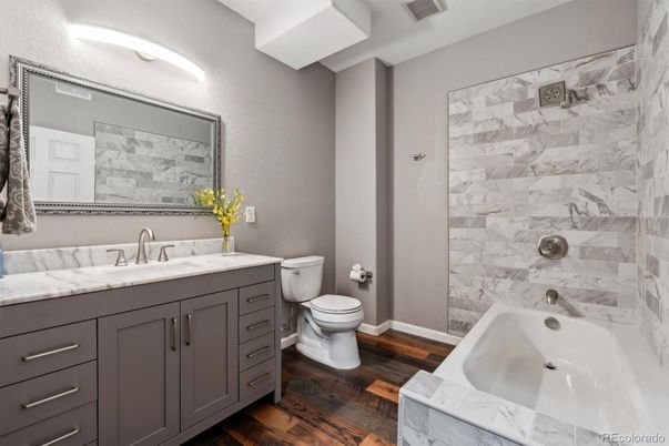 Bathroom, Dual Sink Vanities, Interior, Marble Walls, Wood Texture Flooring