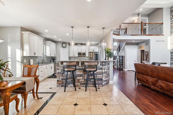 Dining room, Interior, Kitchen, Pendant Lights, Recessed Lighting, Stainless Steel Appliances, Wood Texture Flooring