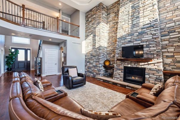 Fireplace, Interior, Living room, Recessed Lighting, Stone Walls, Wood Texture Flooring