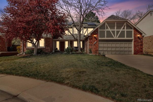 Attached, Exterior, Facade, Brick Facade, Solar Panels, Tudor Revival
