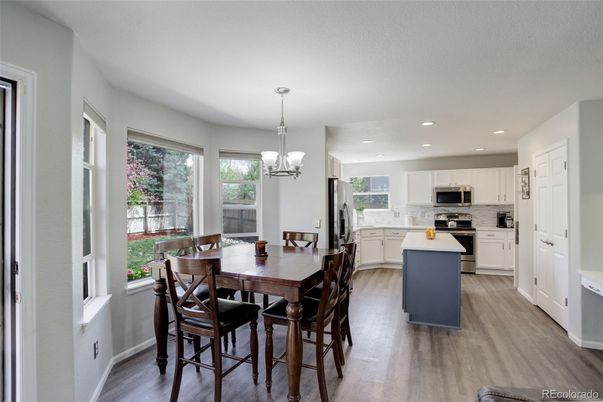 Chandelier, Dining room, Interior, Kitchen, Pendant Lights, Recessed Lighting, Stainless Steel Appliances, Wood Texture Flooring