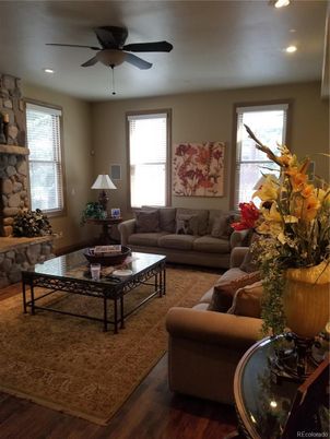 Fireplace, Interior, Living room, Recessed Lighting, Stone Walls, Wood Texture Flooring