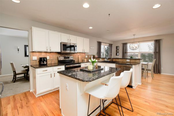 Chandelier, Dining room, Interior, Kitchen, Pendant Lights, Recessed Lighting, Stainless Steel Appliances, Wood Texture Flooring