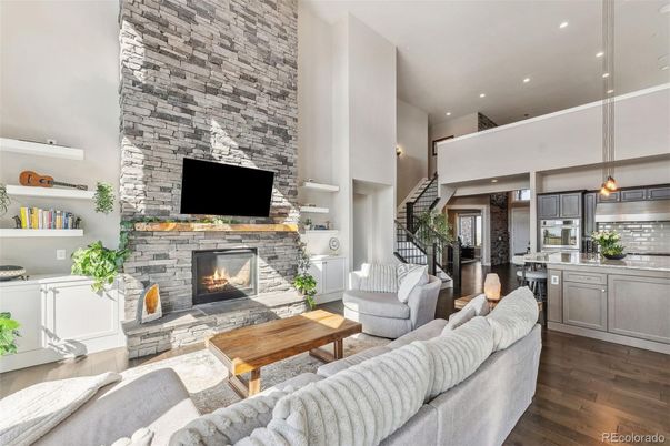 Fireplace, Interior, Kitchen, Living room, Pendant Lights, Recessed Lighting, Stainless Steel Appliances, Stone Walls, Wood Texture Flooring