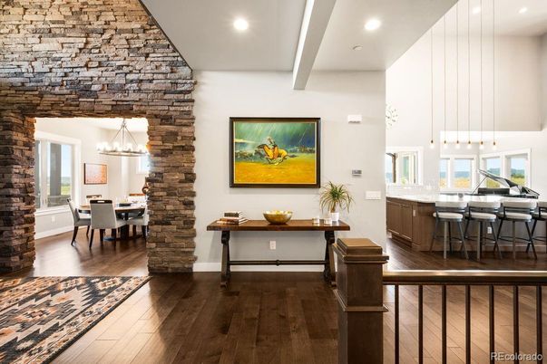 Chandelier, Dining room, Interior, Pendant Lights, Recessed Lighting, Stone Walls, Wood Texture Flooring