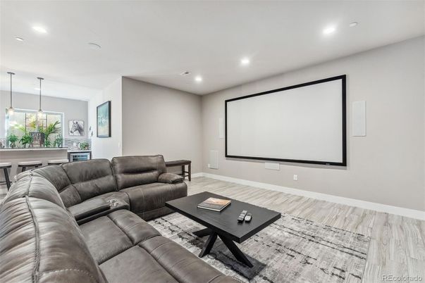 Interior, Living room, Pendant Lights, Projection Screen, Recessed Lighting, Theatre Room, Wood Texture Flooring