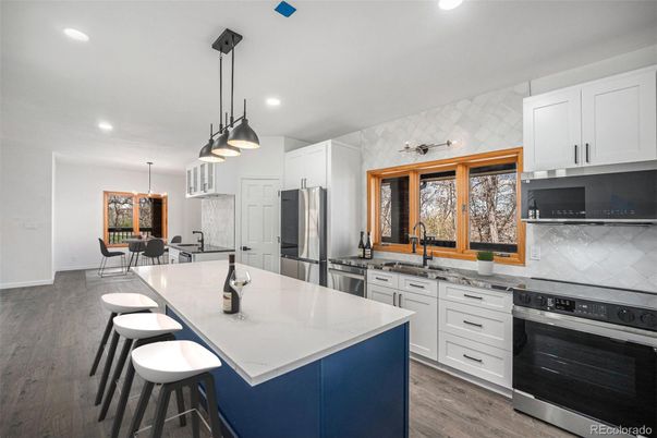 Dining room, Interior, Kitchen, Pendant Lights, Recessed Lighting, Stainless Steel Appliances, Wood Texture Flooring