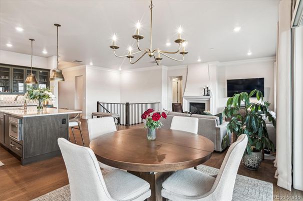Chandelier, Dining room, Fireplace, Interior, Kitchen, Pendant Lights, Recessed Lighting, Wood Texture Flooring