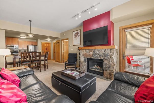Dining room, Fireplace, Interior, Kitchen, Living room, Pendant Lights, Stainless Steel Appliances